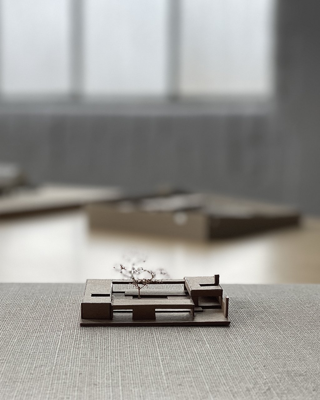 Model in brown craft card at 1:500.